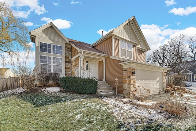 view of front of property with a garage and a lawn