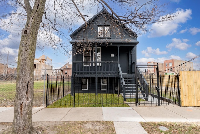 view of front of home featuring a front yard and a porch