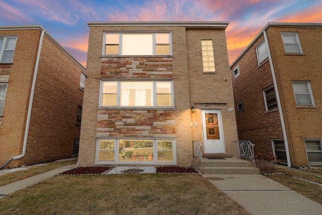 view of front of home with a yard