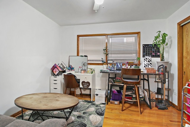 office with hardwood / wood-style flooring and ceiling fan