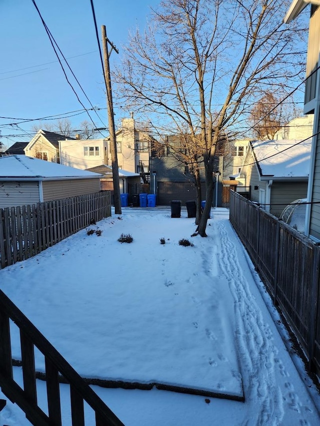 view of yard covered in snow