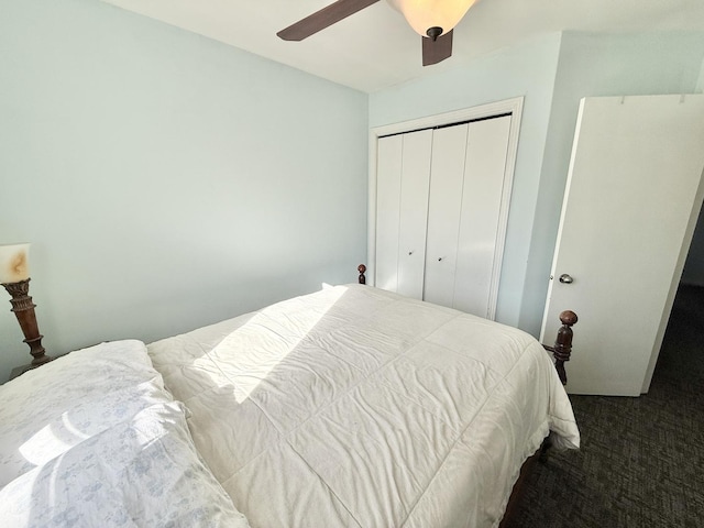 carpeted bedroom with a closet and ceiling fan