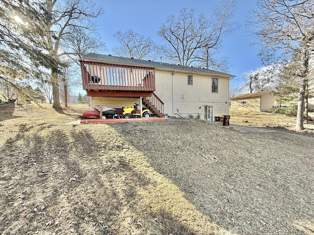 back of house featuring a deck