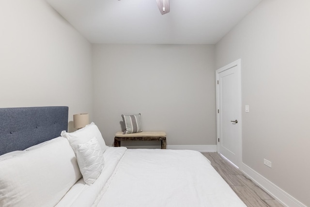 bedroom with ceiling fan and hardwood / wood-style floors