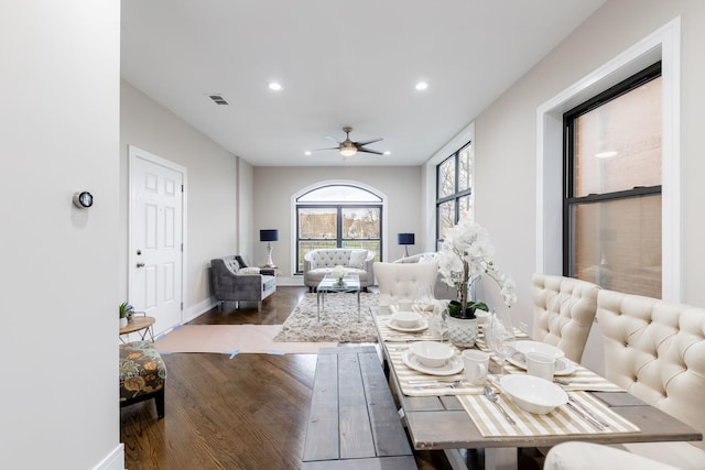 dining area featuring ceiling fan and dark hardwood / wood-style flooring