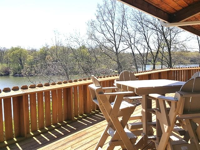 wooden deck with a water view