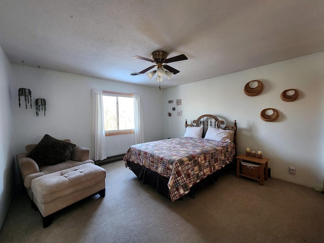 carpeted bedroom with ceiling fan and a textured ceiling