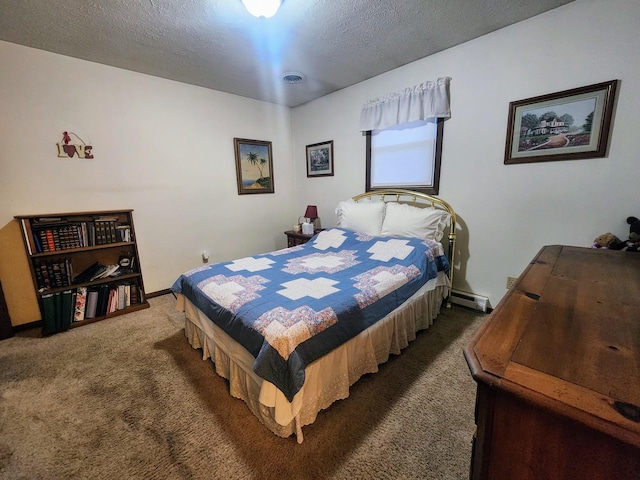 bedroom featuring baseboard heating, a textured ceiling, and dark colored carpet