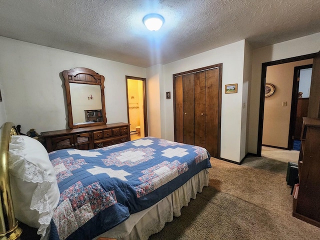 bedroom featuring a textured ceiling, a closet, and carpet flooring