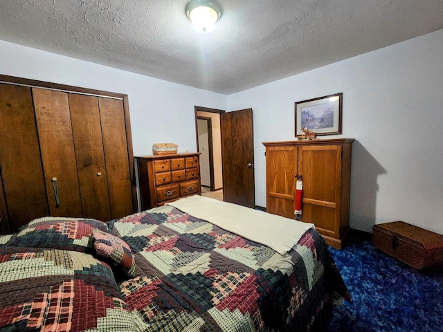 carpeted bedroom featuring a closet and a textured ceiling