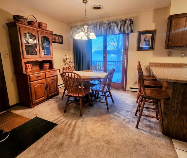 carpeted dining room with a baseboard radiator and an inviting chandelier