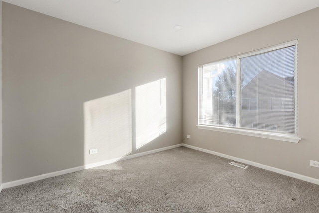 spare room featuring carpet flooring