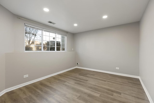 spare room featuring hardwood / wood-style floors