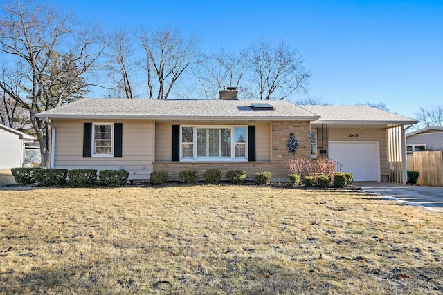 single story home featuring a garage, a front yard, and a carport