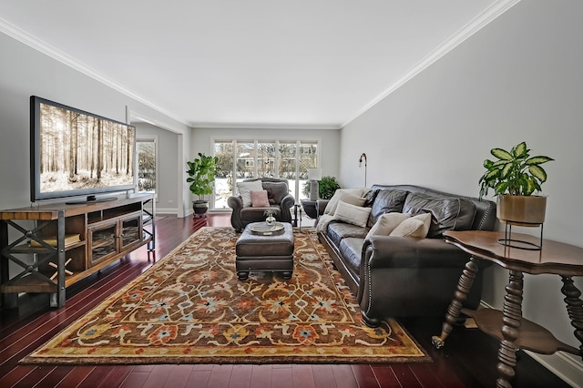 living area featuring plenty of natural light, ornamental molding, dark wood finished floors, and baseboards