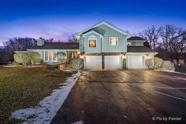 view of front of property with a garage