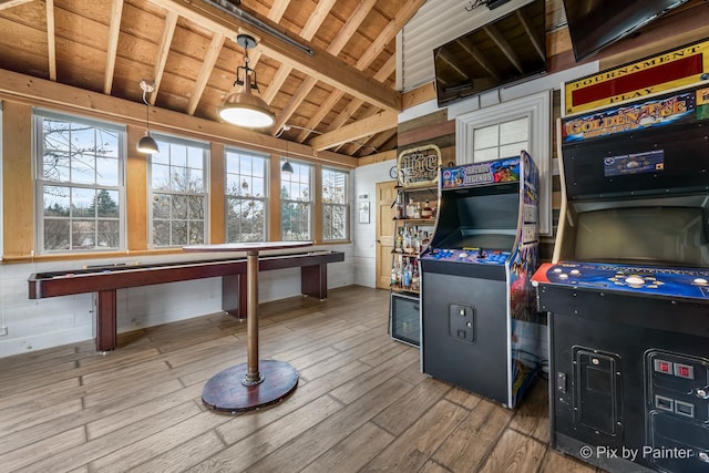 playroom with hardwood / wood-style floors, wood ceiling, and vaulted ceiling with beams