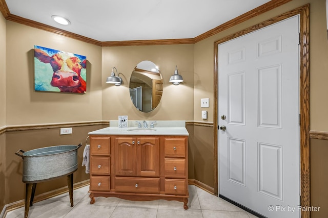 bathroom featuring vanity, tile patterned floors, and ornamental molding