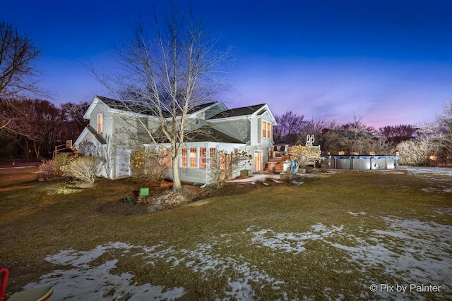 view of yard at dusk