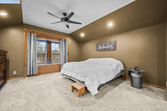 bedroom featuring ceiling fan, vaulted ceiling, and carpet