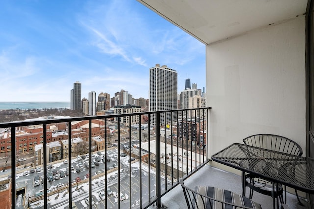 balcony featuring a water view