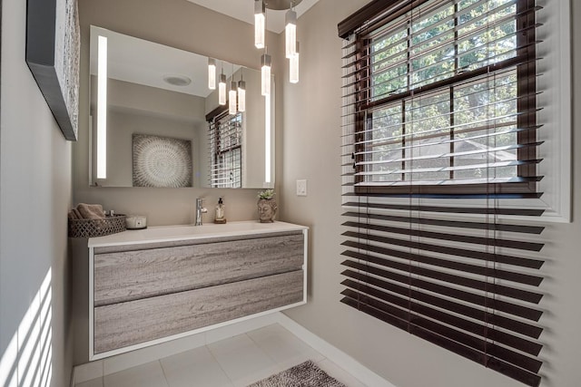 bathroom with tile patterned floors and vanity