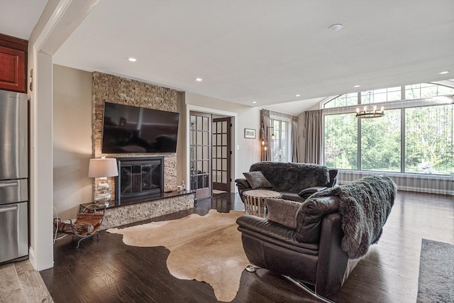 living room with hardwood / wood-style floors and a fireplace