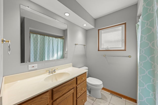 bathroom featuring tile patterned flooring, toilet, visible vents, vanity, and baseboards