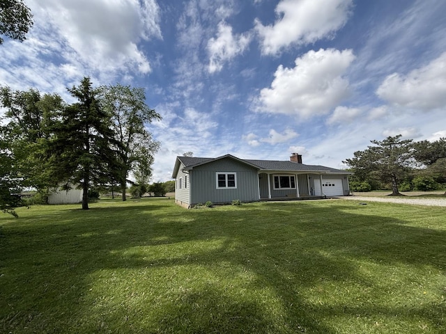 38W715 Huntley Rd, West Dundee, IL 60118 - view of front of property featuring a garage, a front lawn, a chimney, and dirt driveway