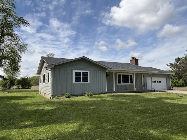 38W715 Huntley Rd, West Dundee, IL 60118 - view of front facade with a garage, a chimney, a front lawn, driveway, and a porch