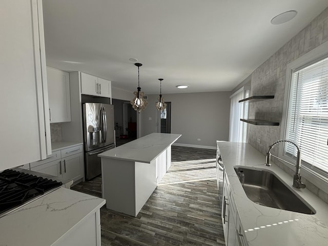38W715 Huntley Rd, West Dundee, IL 60118 - kitchen featuring stainless steel fridge with ice dispenser, open shelves, a center island, dark wood-style flooring, and light stone counters