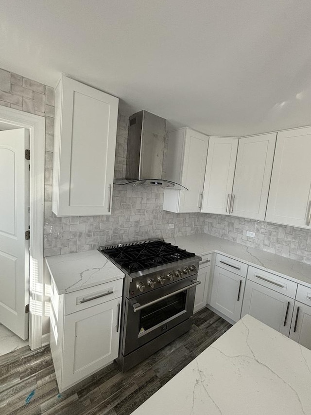 38W715 Huntley Rd, West Dundee, IL 60118 - kitchen with wall chimney exhaust hood, stainless steel range, dark wood-type flooring, light stone counters, and white cabinetry