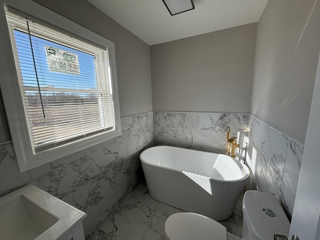 bathroom with tile walls, toilet, and a bathing tub