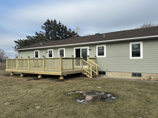 back of house featuring a yard and a deck