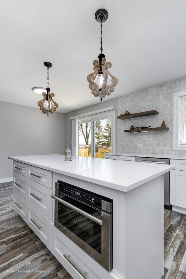38W715 Huntley Rd, West Dundee, IL 60118 - kitchen with stainless steel appliances, dark wood finished floors, white cabinets, and plenty of natural light
