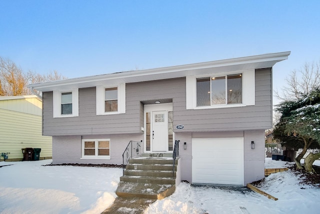 split foyer home featuring a garage