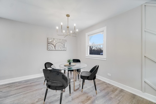 dining room featuring an inviting chandelier and light hardwood / wood-style floors