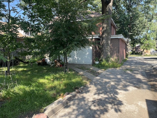 view of side of home featuring a garage