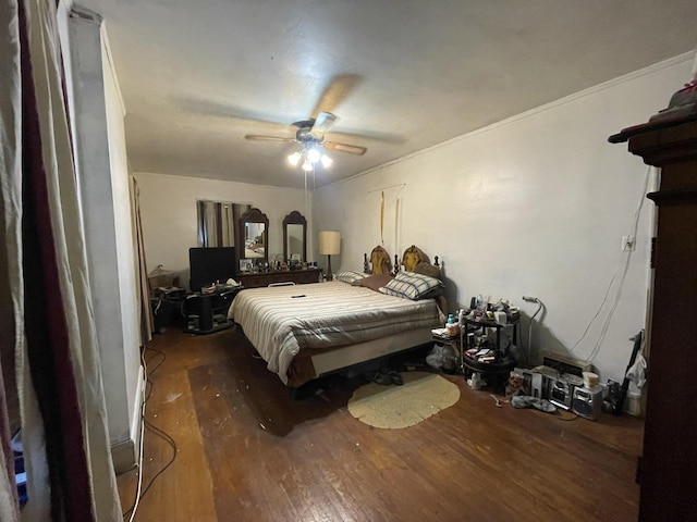 bedroom with ceiling fan and dark hardwood / wood-style flooring