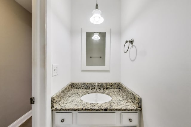 bathroom featuring vanity and baseboards