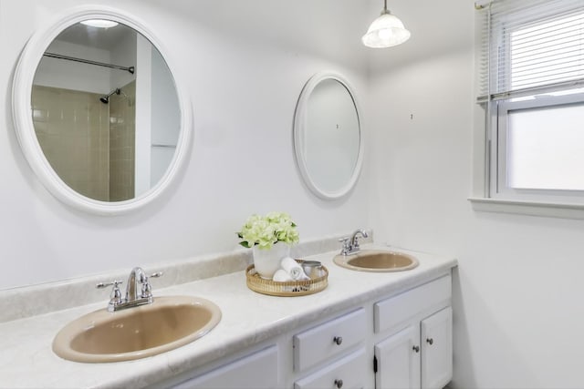 bathroom with a sink and double vanity