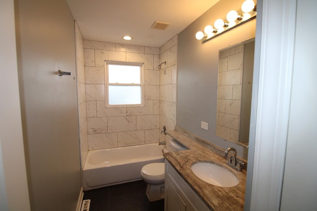 full bathroom with toilet, tile patterned flooring, tiled shower / bath combo, and vanity