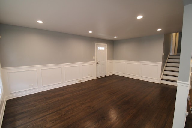 basement featuring dark hardwood / wood-style flooring