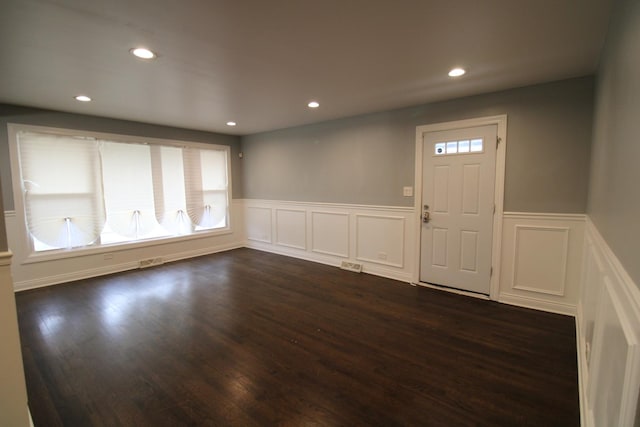 entrance foyer with dark hardwood / wood-style flooring