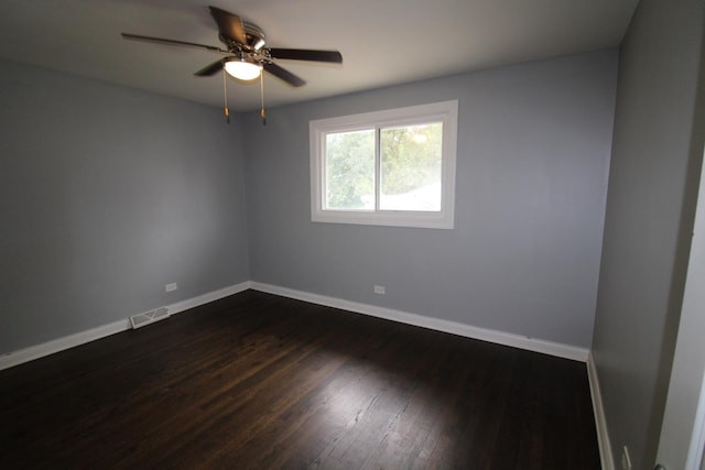 unfurnished room featuring ceiling fan and dark hardwood / wood-style flooring