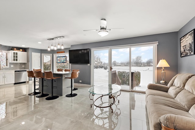 living room with ceiling fan