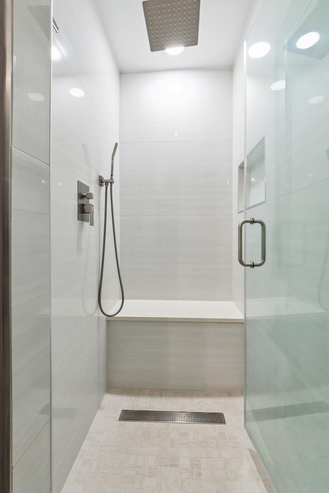 bathroom featuring an enclosed shower