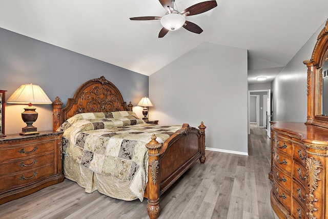 bedroom featuring vaulted ceiling, ceiling fan, and light hardwood / wood-style floors