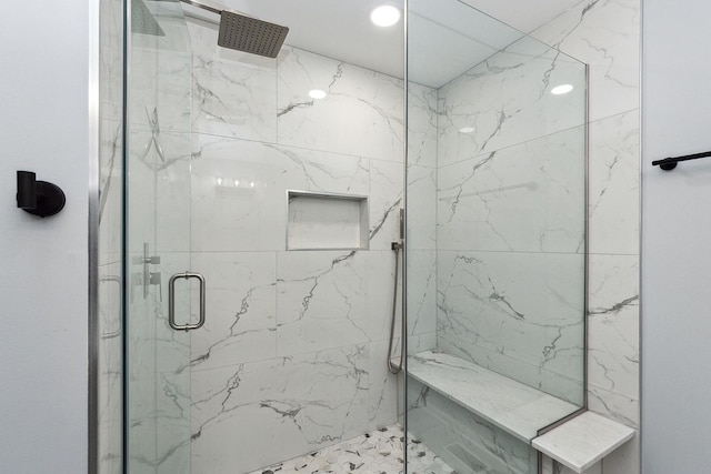 bathroom featuring an enclosed shower