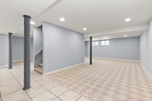 basement featuring light tile patterned flooring